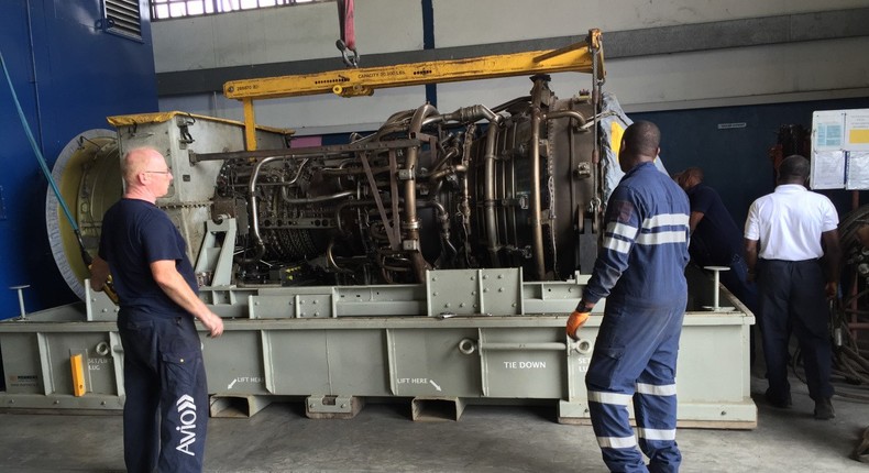 Field service engineers assess the gas turbine in Port Harcourt, Nigeria.