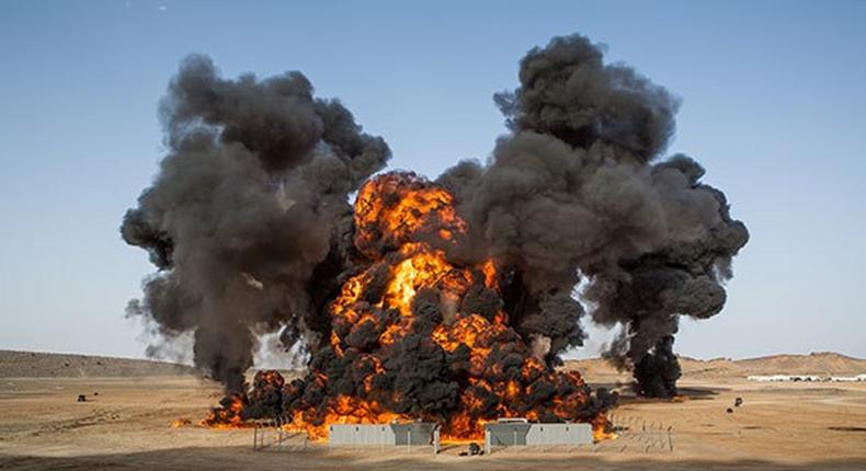 Four oil tanks on fire at Libyan ports after clashes with terrorists