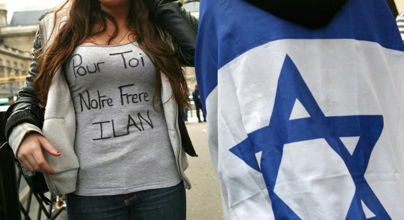 Halimi was tortured for three weeks. The slogan on the woman's T-shirt reads For you, our brother Ilan