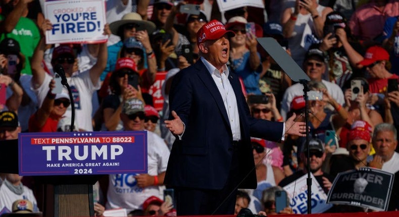 Former president Donald Trump was photographed moments before shots rang out at a rally in Pennsylvania on Saturday.Jeff Swensen/Getty Images