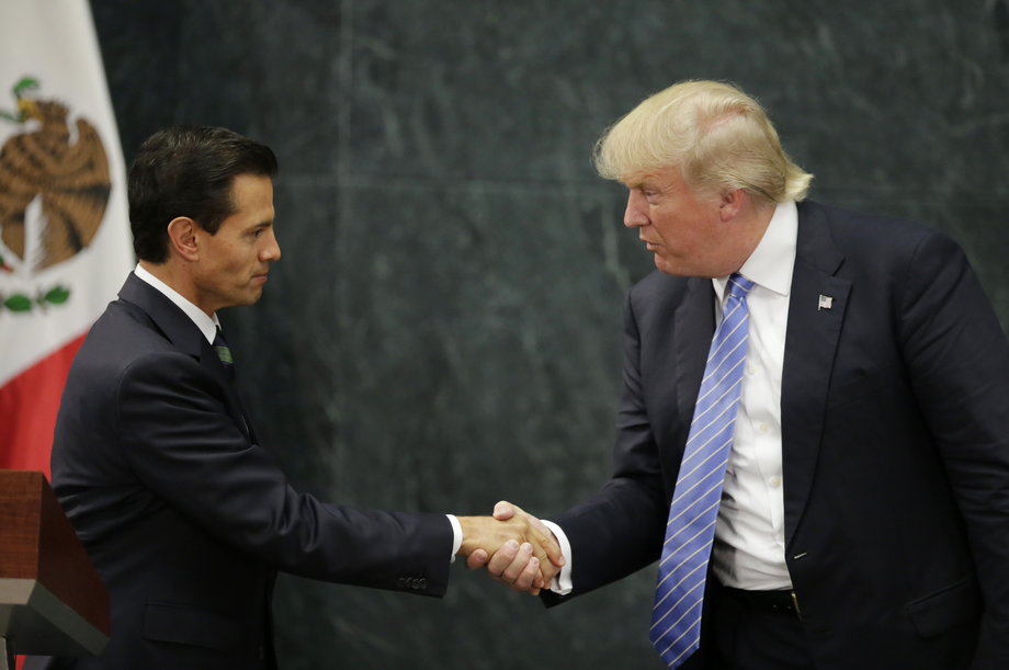 US Republican presidential nominee Donald Trump and Mexican President Enrique Peña Nieto shake hands in Mexico City, August 31, 2016.