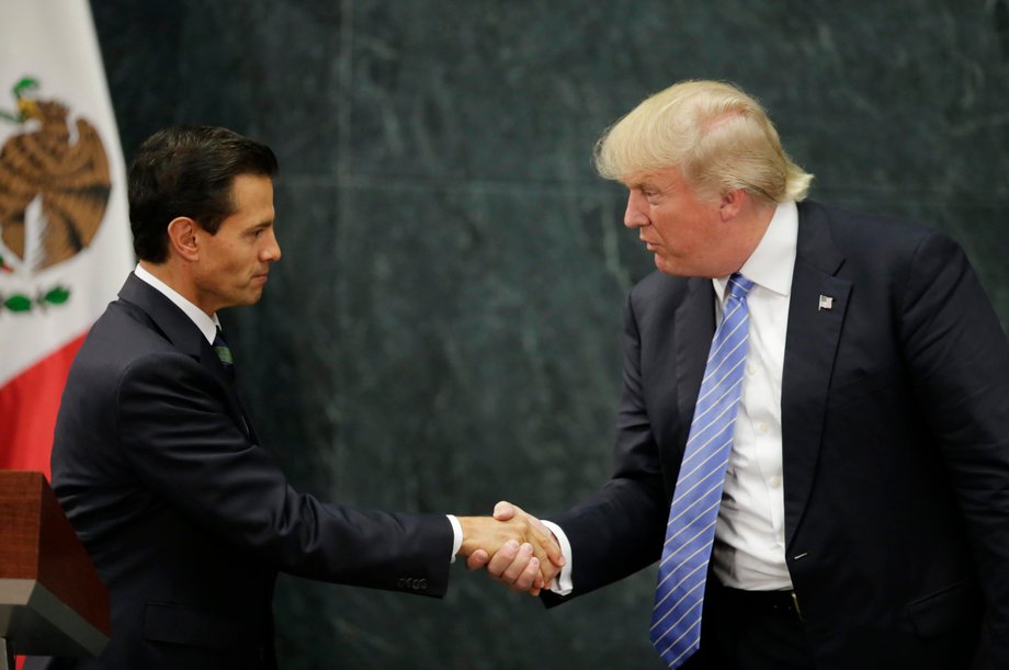 US Republican presidential nominee Donald Trump and Mexican President Enrique Peña Nieto shake hands in Mexico City, August 31, 2016.