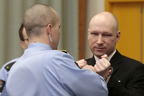 Mass killer Anders Behring Breivik has his handcuffs removed upon his arrival at the court room in S