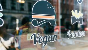 A vegan sign on a restaurant window.DigitalVision/Getty Images