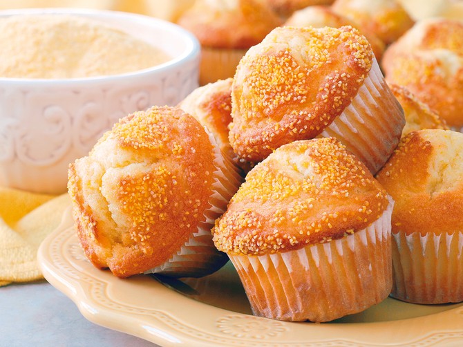 10394_stock-photo-close-up-of-corn-muffins-on-plate-with-bowl-of-corn-meal-and-additional-muffins-in-the-background-shutterstock_6577783