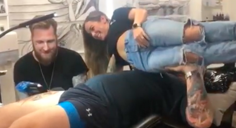 The Mountain Bench Presses Wife in Tattoo Studio