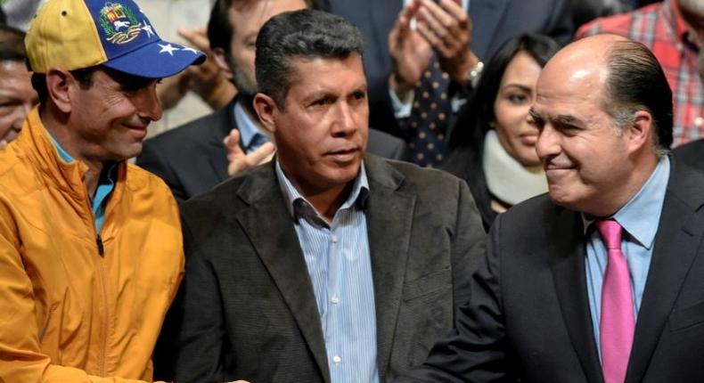 (L-R) Opposition leader Henrique Capriles Radonski, Lara State governor Henry Falcon and the president of the Venezuelan National Assembly Julio Borges during a meeting with different sectors of the civil society