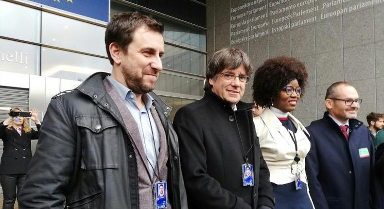 Former Catalan regional president Carles Puigdemont (centre-left) and his health minister Toni Comin (left) were elected to the European Parliament in May