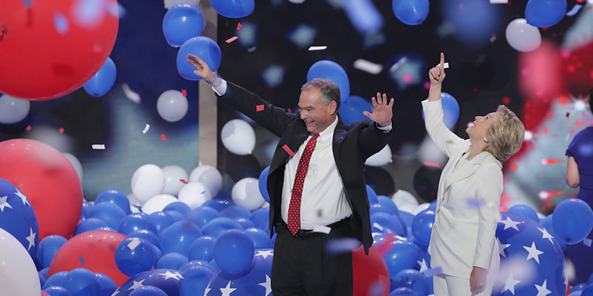 Democratic presidential candidate Hillary Clinton and US vice-presidential nominee Tim Kaine stand on stage at the end on the fourth day of the Democratic National Convention.