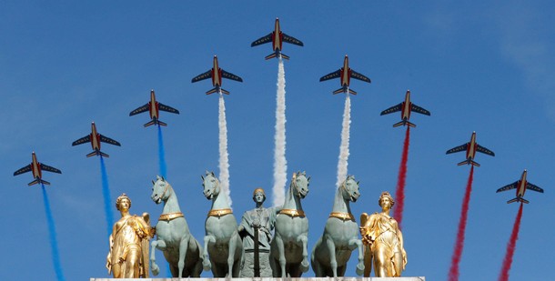 Alpha jets from the French Air Force Patrouille de France fly over the Arc de Triomphe du Carrousel 