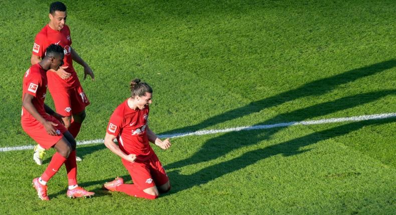 Leipzig midfielder Marcel Sabitzer (R) celebrates scoring the opening goal at Hertha Berlin