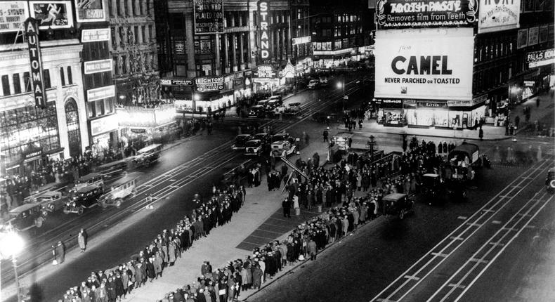 Thousands of unemployed people are gathered in a food line in Times Square during the Great Depression.AP Photo