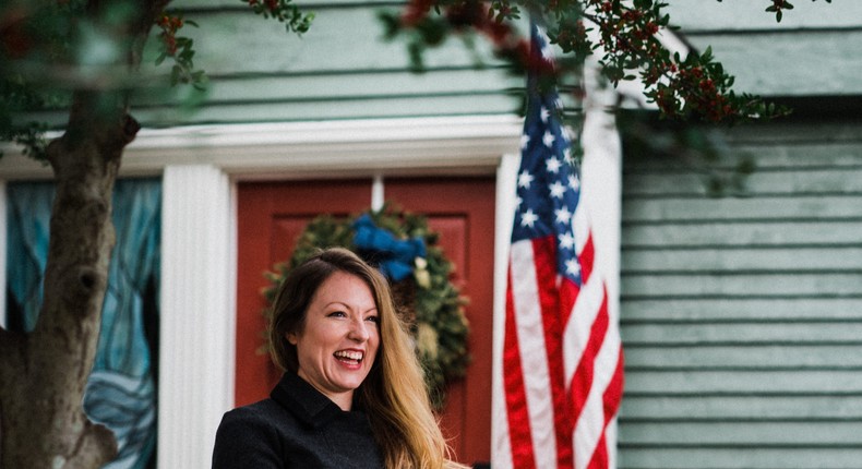 Jen Smith — a participant in the Tulsa Remote program, which offers $10,000 toward a new home — in front of her brand-new Oklahoma digs.Jon Ratzlaff/Tulsa Remote