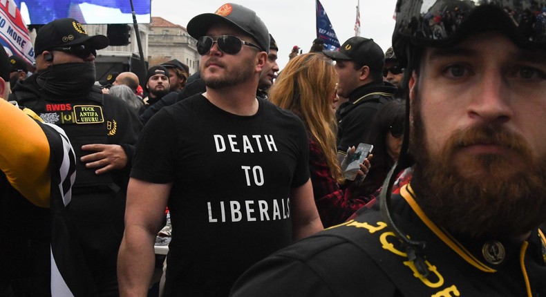 A member of the Proud Boys wearing a t-shirt that reads death to liberals stands with other Proud Boys in Freedom Plaza during a protest on December 12, 2020 in Washington, DC.Stephanie Keith/Getty Images