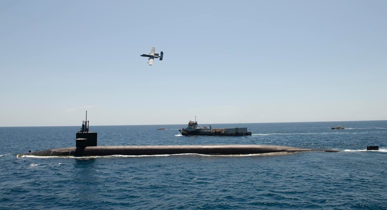 An A-10 Thunderbolt II aircraft above the ballistic missile submarine USS Wyoming on July 15.US Navy photo