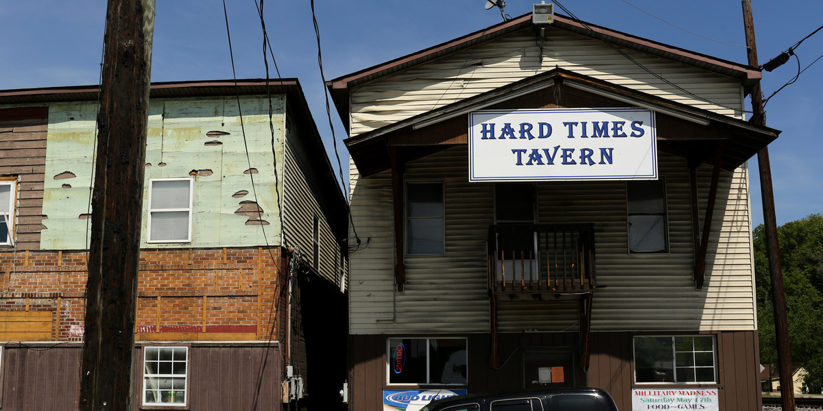 A car is parked outside of the "Hard Times Tavern" in Fort Gay, West Virginia May 19, 2014.