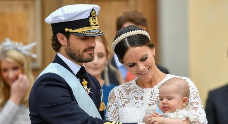 Sweden's Prince Carl Philip (L) and Princess Sofia at the christening of their first child Prince Alexander in September last year