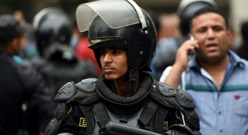 An Egyptian riot policeman stands guard during a protest of journalists on May 4, 2016 outside the Journalists' Syndicate headquarters in Cairo