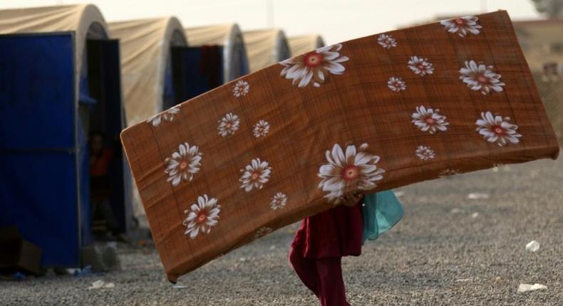 A displaced Iraqi who fled the violence in Mosul, at al-Khazar camp on October 27, 2016