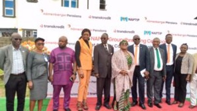 Rep. Chinwe Nnabuife, Mr Hassan Tahir, Rep of NAPTIP D-G, Prof Fatima Waziri-Azi and officials of Financial Houses and Estate Developers all posed for photograph (Credit: NAN)