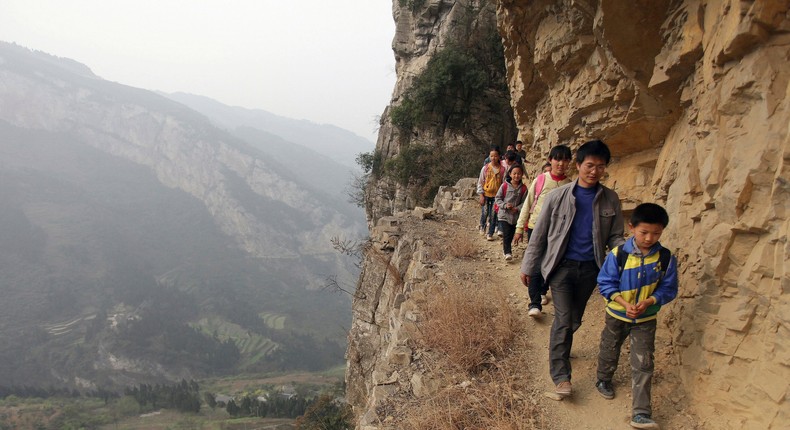 Kids around the world navigate knee-deep water and treacherous cliffs just to get to school.