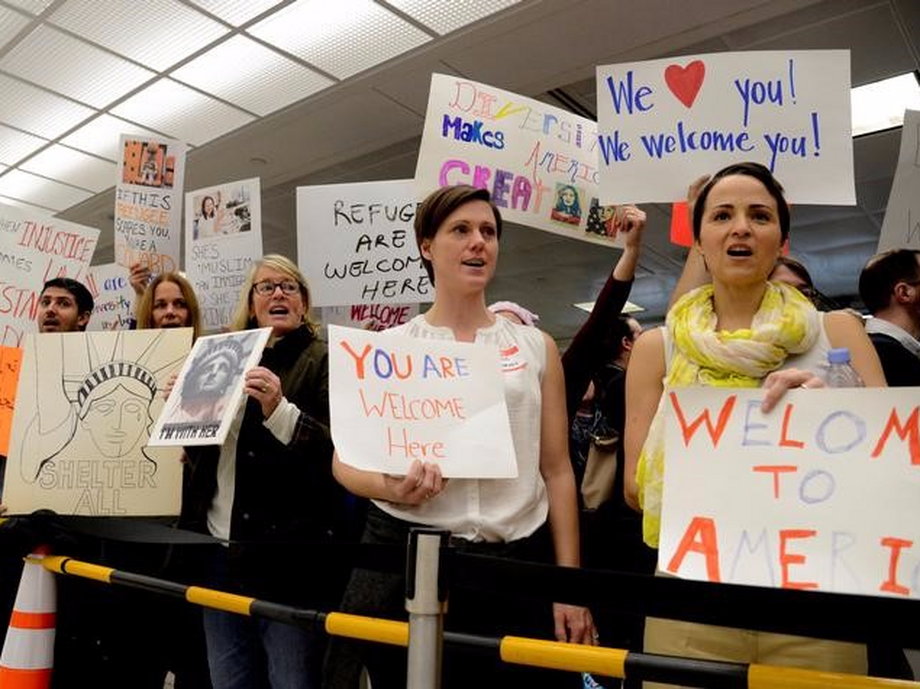 Pro-immigration demonstrators hold protest at Dulles International Airport.