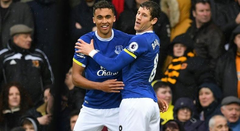 Everton's striker Dominic Calvert-Lewin (L) celebrates with midfielder Ross Barkley after scoring the opening goal of the English Premier League football match against Hull City March 18, 2017