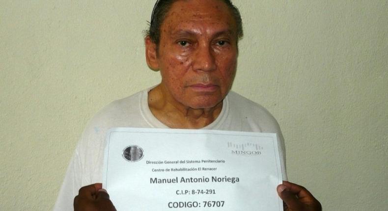 This handout file picture taken on December 14, 2011 shows Panamanian former dictator Manuel Noriega having his mug shot being taken at the El Renacer penitentiary, 25 km southeast of Panama City