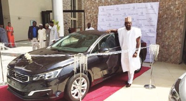 Kunle Afolayan with Peugeot 508