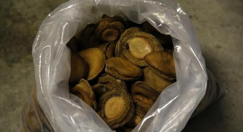 A bag of dried abalone confiscated from suspected poachers is seen in Cape Town March 13, 2014. REUTERS/Mike Hutchings