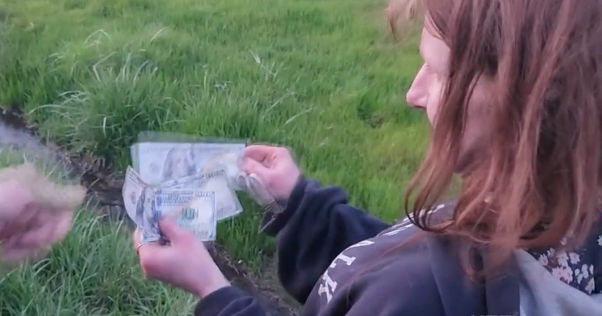 A man threw stacks of 100 bills from his car window in a wild show of