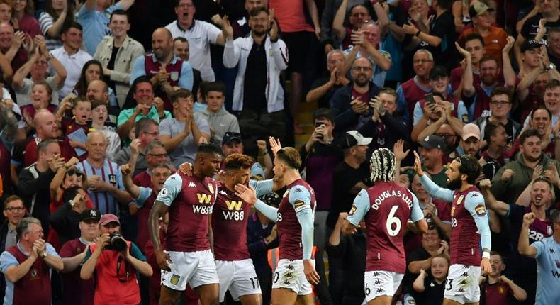 Aston Villa's Wesley (L) celebrates with his team-mates after scoring against Everton