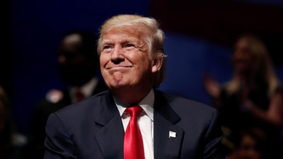 Republican presidential nominee Donald Trump is seen on stage during a campaign town hall meeting in