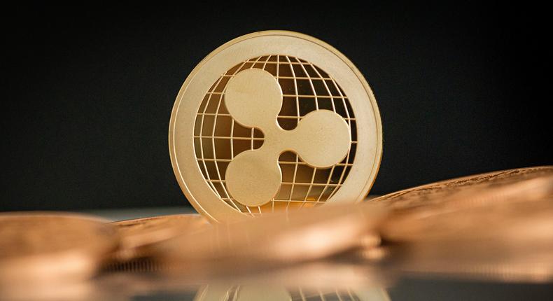 A ripple coin stands on a table