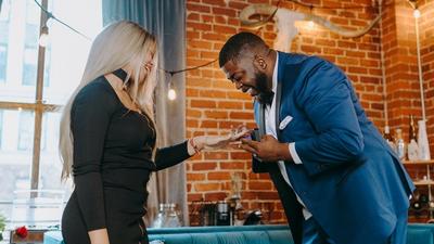 A man proposing to his partner, a complete guide to planning a Valentine's Day proposal in 10 days [Image Credit: RDNE Stock Project]