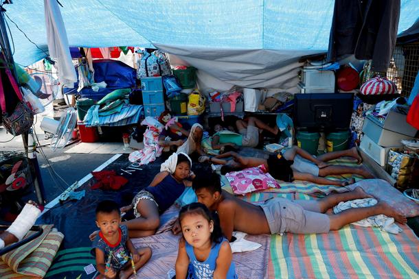 The Wider Image: Manila's slums an endless battle for firefighters