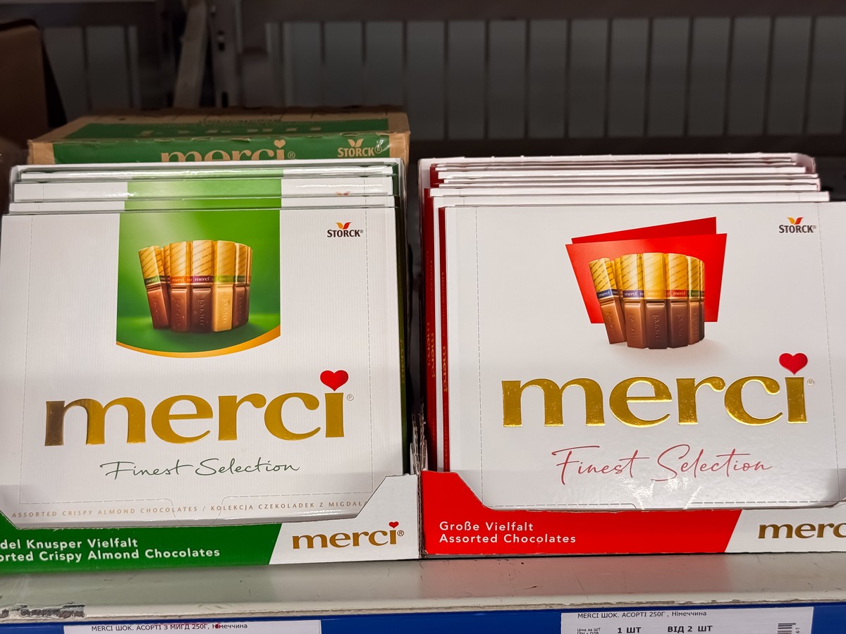Merci,Finest,Selection,Chocolate,Boxes,Displayed,On,Supermarket,Shelf,With