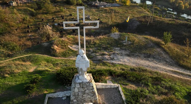 A cross is seen at the Monument of the Mother of God outside the city center on October 3, 2022 in Izium, Ukraine.