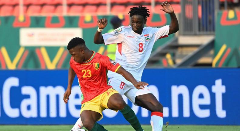 Aguibou Camara (L) of Guinea fights for the ball with Ebrima Darboe of Gambia in an Africa Cup of Nations last-16 match in Bafoussam on Monday Creator: Pius Utomi EKPEI