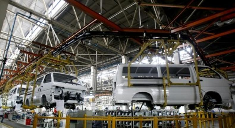 Cars are assembled in a workshop of an automobile factory in Shenyang, northeast China's Liaoning province