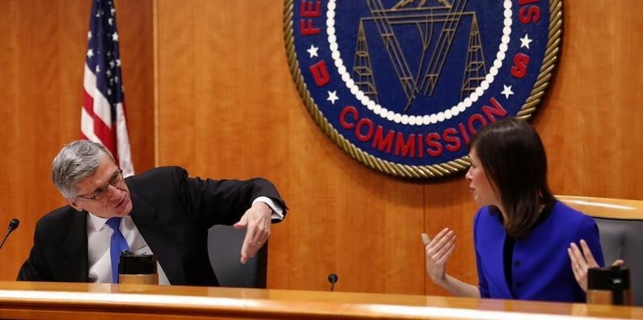 Federal Communications Commission Chairman Tom Wheeler and commissioner Jessica Rosenworcel talk at the FCC Net Neutrality hearing in Washington