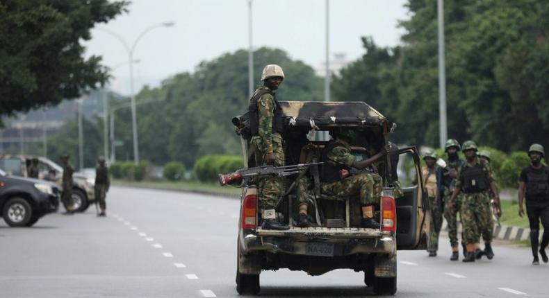 Soldiers aboard a truck patrol during a violent protest by Shiite Muslims demanding the release of their detained leader Ibrahim Zakzaky on July 23, 2019 in Abuja