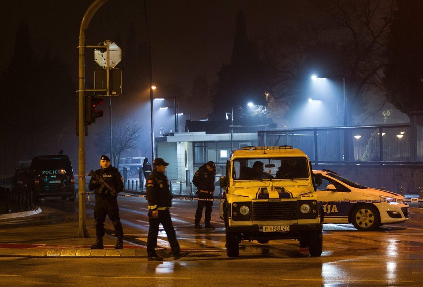 Police guard the entrance to the United States embassy building in Podgorica