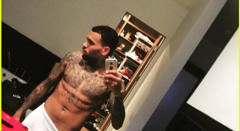 Chris Brown in towel on New Year's Eve