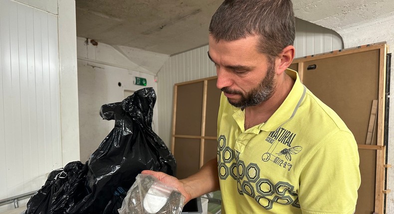 Romain Andenmatten shows a horseshoe found on a melting glacier.Morgan McFall-Johnsen