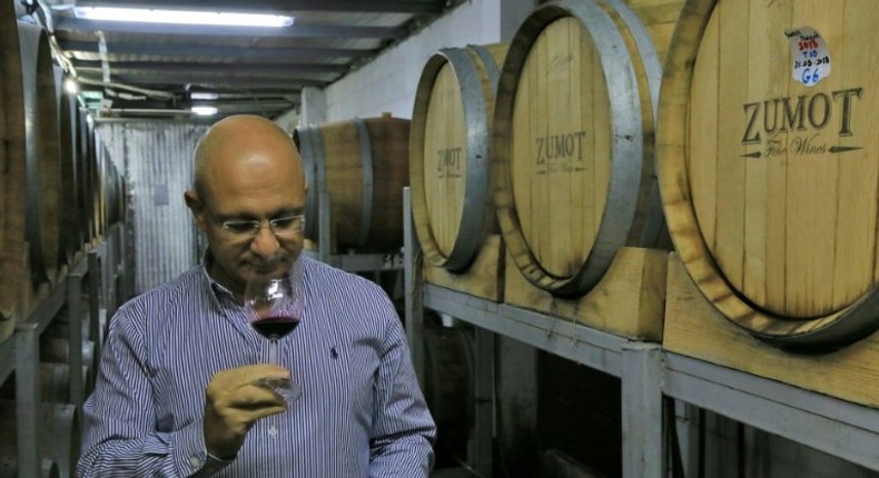 Omar Zumot, manager of Amman's Saint George winery and who studied winemaking in France, samples a glass as two Jordanian families look to revive an age-old tradition that some suggest has Biblical heritage