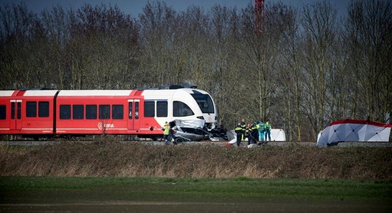 Emergency personnel work at the scene of a train crash on March 27, 2017 near Harlingen, northern Netherlands