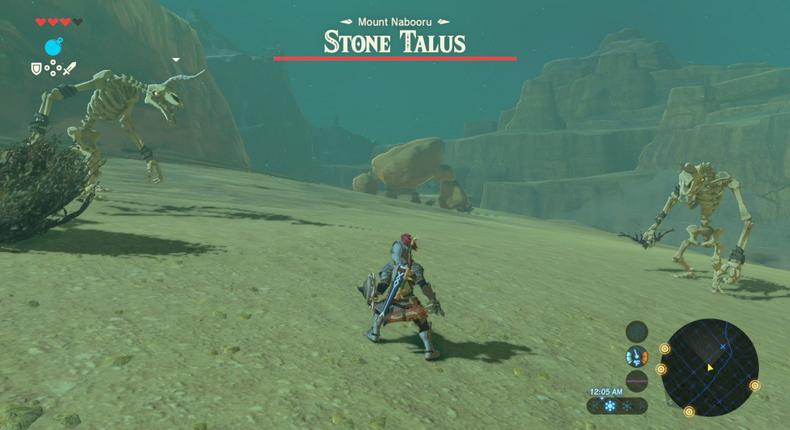 That guy in the distance is a Stone Talus. He's basically a large boulder with rocks for arms. Good luck!