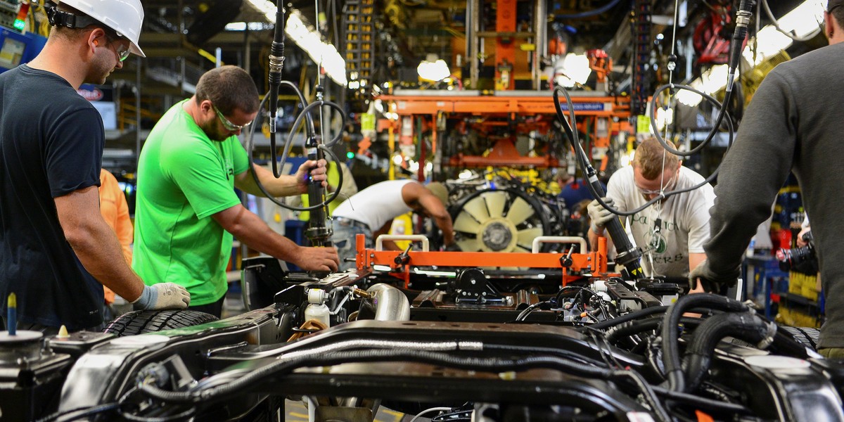 Ford workers building a truck.