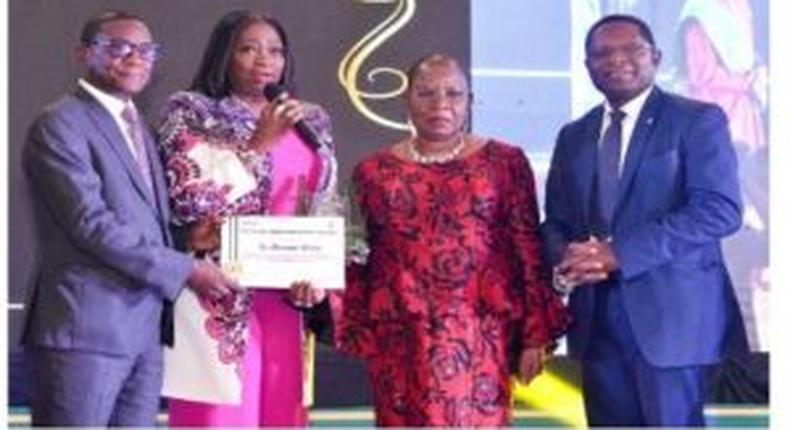L-R; Lamin Barrow AfDB Nigeria received the award on behalf of Adesina (Credit: NAN)